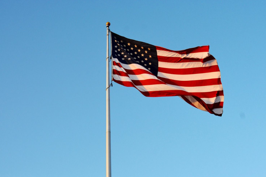 The American Flag against a blue sky.